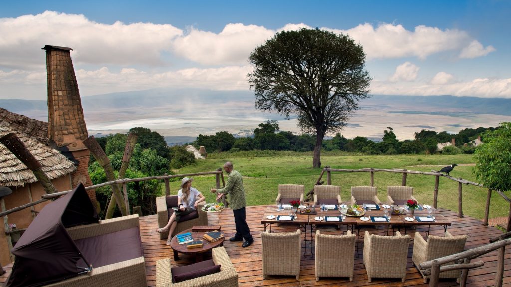 Tourist sitting and dining area at andbeyond ngorongoro crater lodge on a luxury tanznia safari