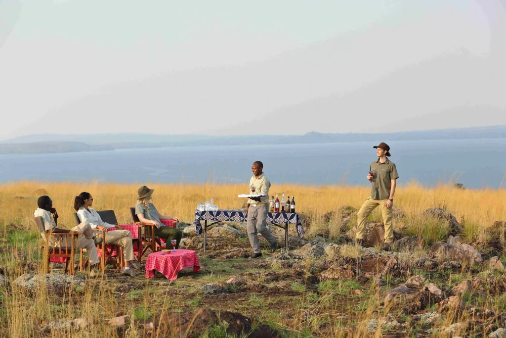 clients during Safari in Tanzania served snacks while waiting for sunset at Rubondo Island