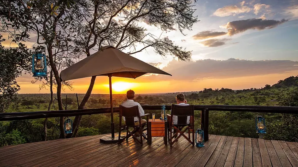 Guests at Elewana Serengeti Migration Camp during the sunset hours