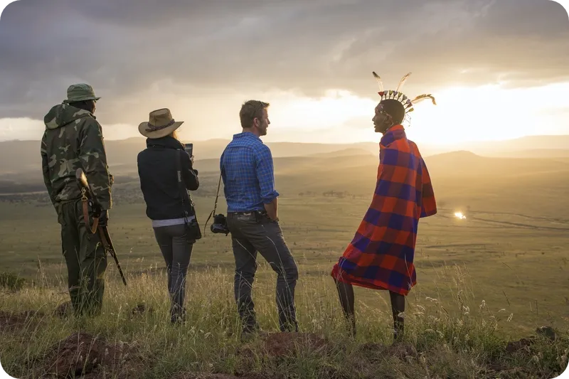 Tourist with Maasai in the heart of Serengeti