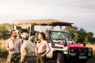 couple at Serengeti National Park enjoying their honeymoon with the local guide