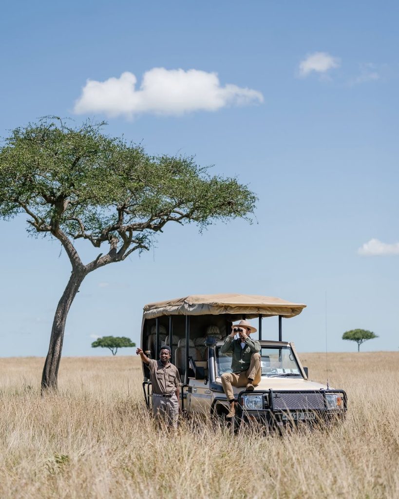 Guest on a transformative Tanzania safari 11-day departure breathing open Serengeti air — East Africa Safari Guides