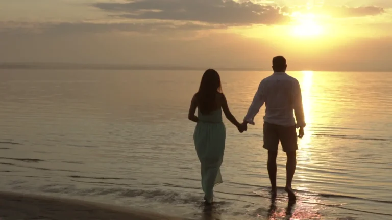 Couples walking on the beach